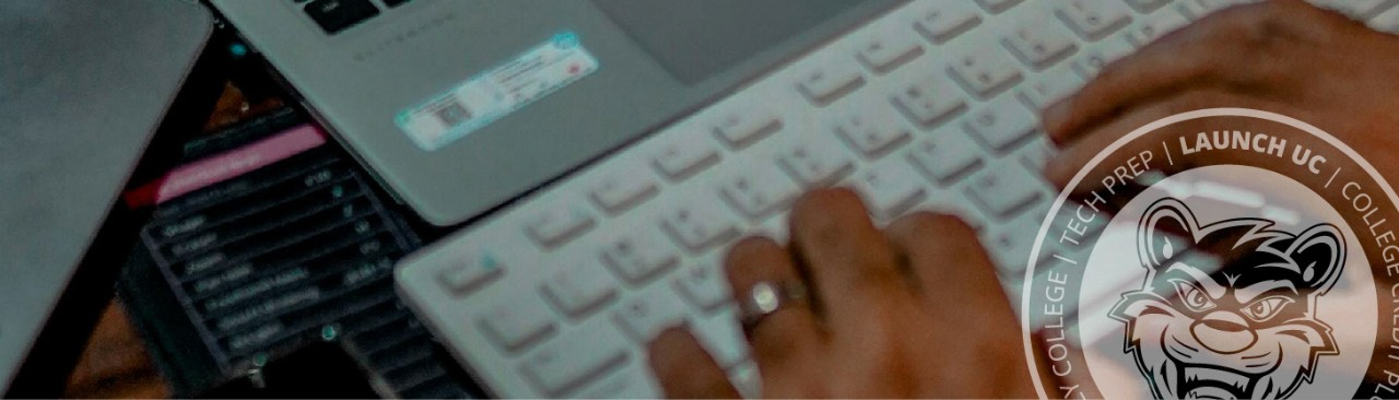 Hands typing on a keyboard