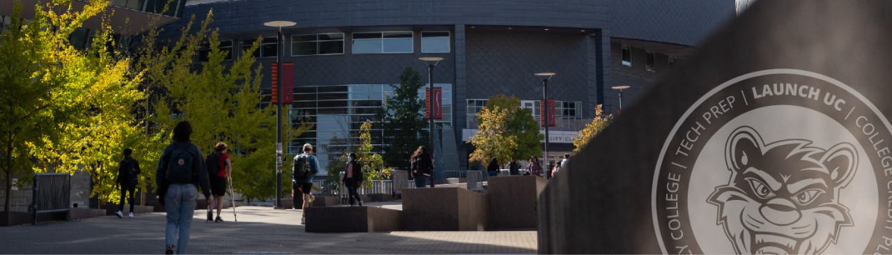 Students walking up campus Main Street