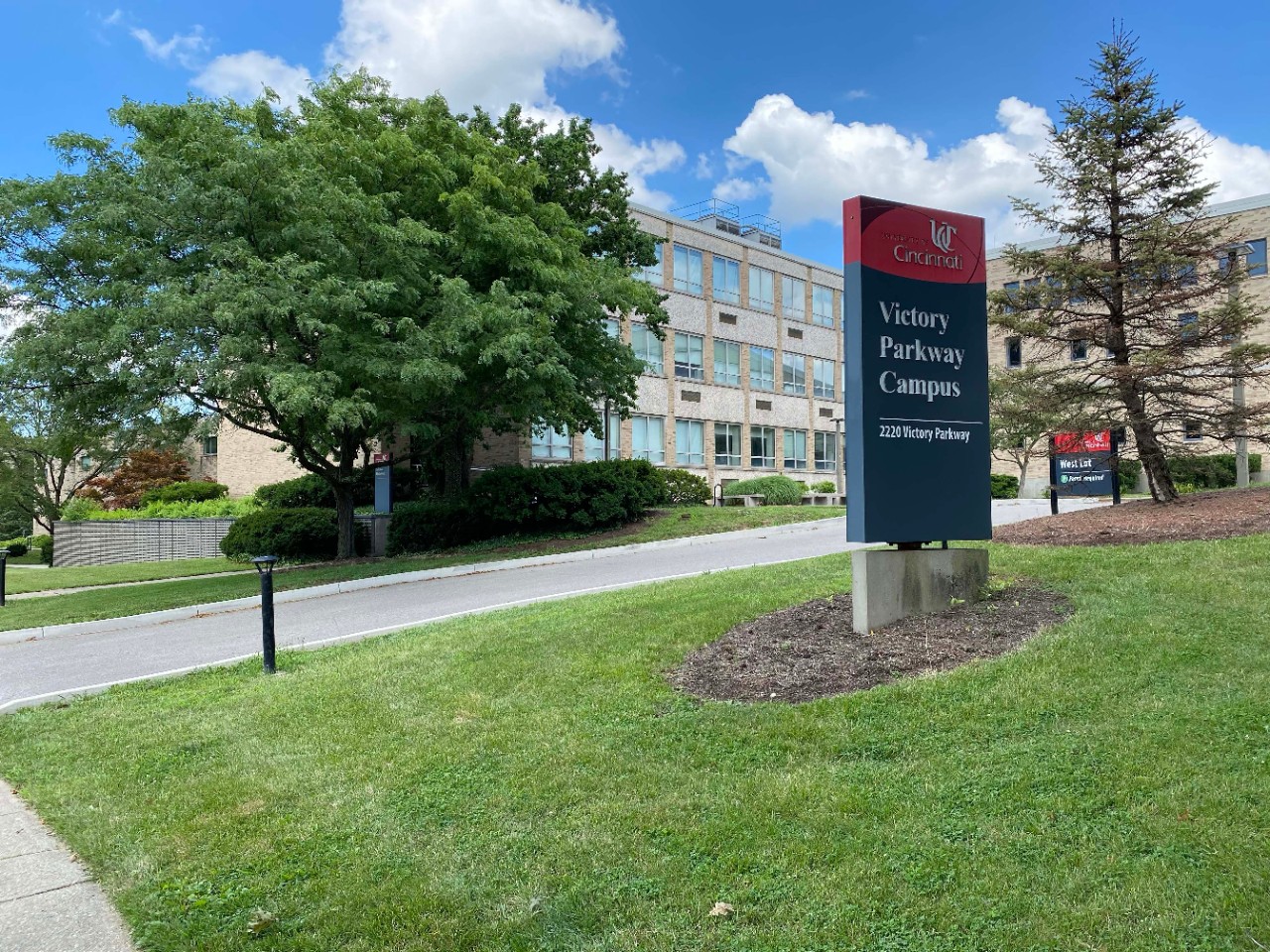 front lawn of Victory Parkway Campus with campus sign in the foreground