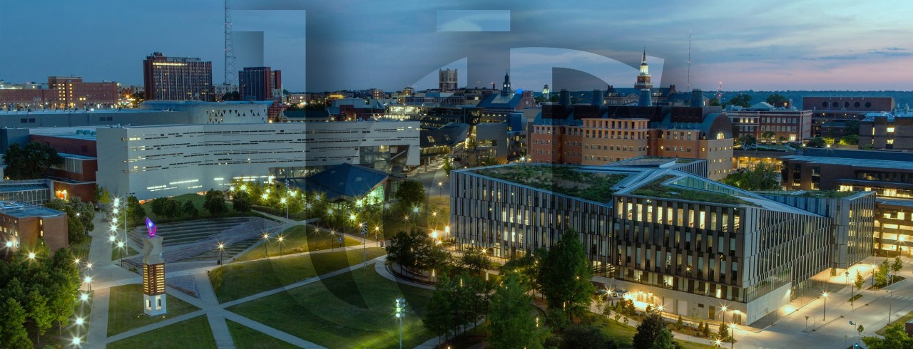 Aerial view of UC's campus at sunset