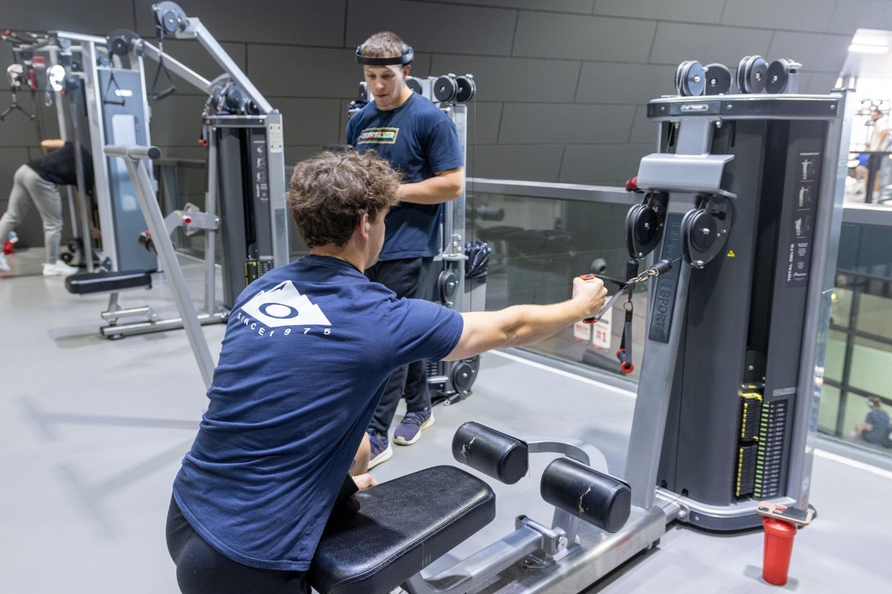 Visitors to Campus Recreation Center working out on treadmills.