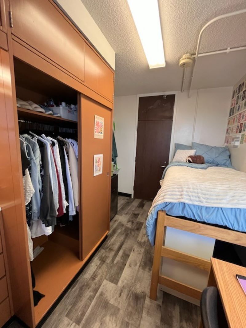 Front of twin bed view with closet