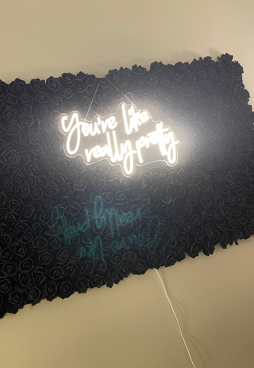 Lighted wall hanging that says you're like really pretty