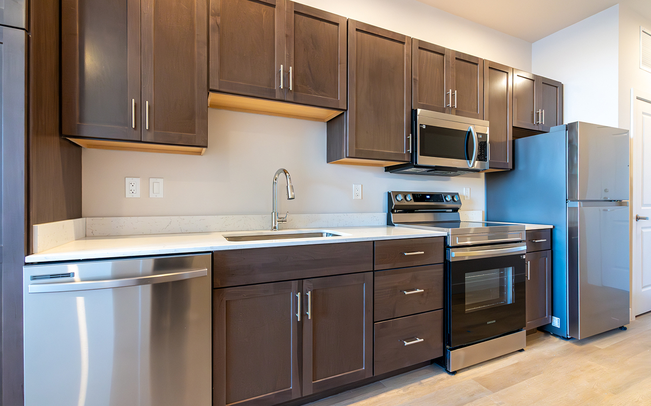 Kitchen featuring microwave, stove, refrigerator and dishwasher