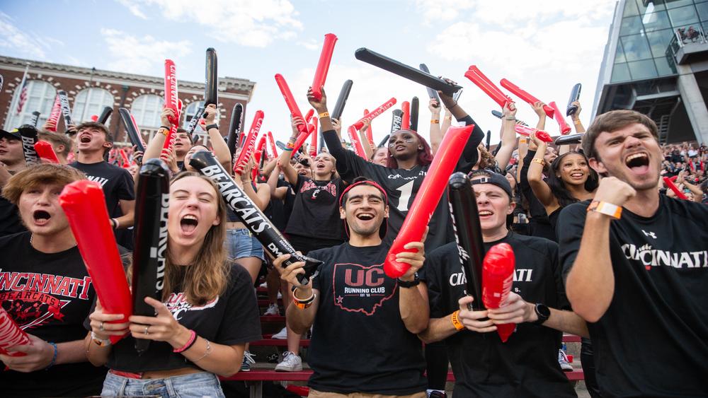 UC students cheer on UC football game