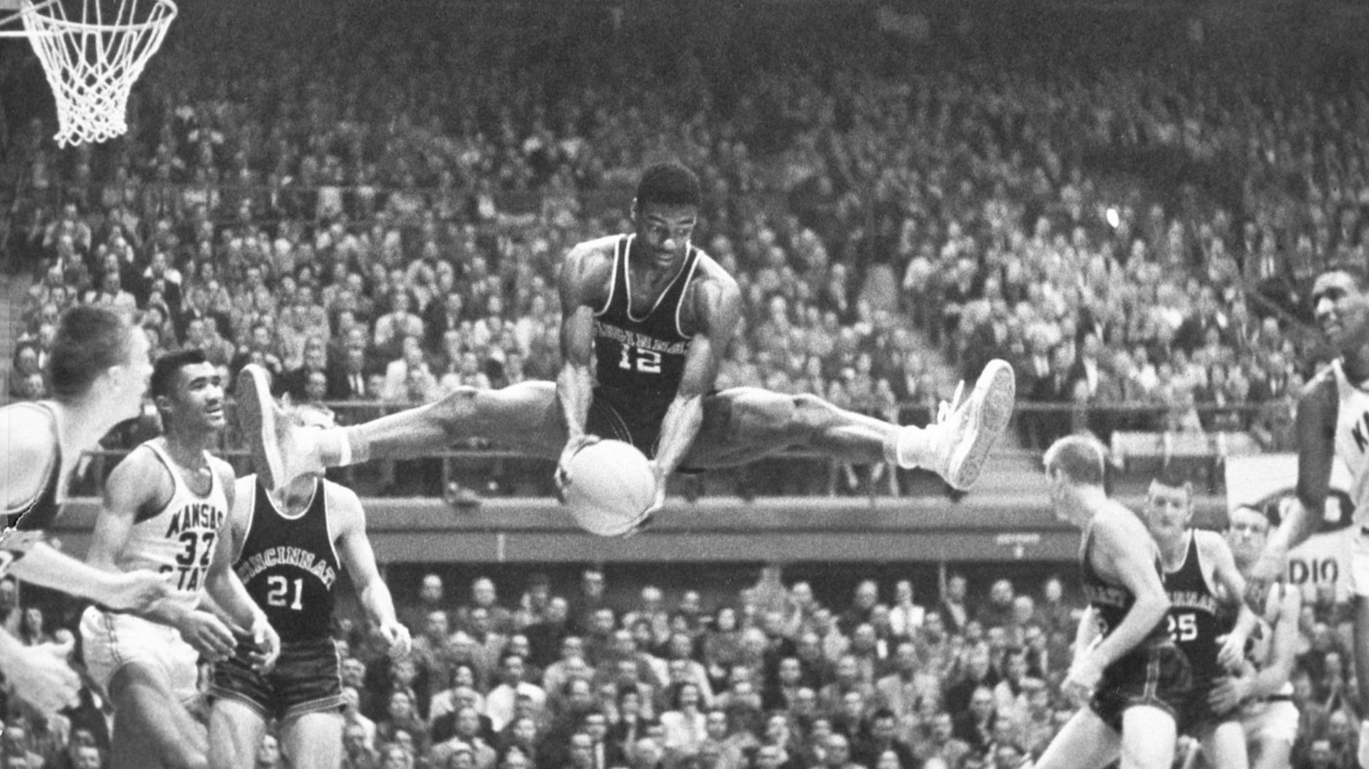 Hall of Famer Oscar Robertson jumps to dunk a basketball