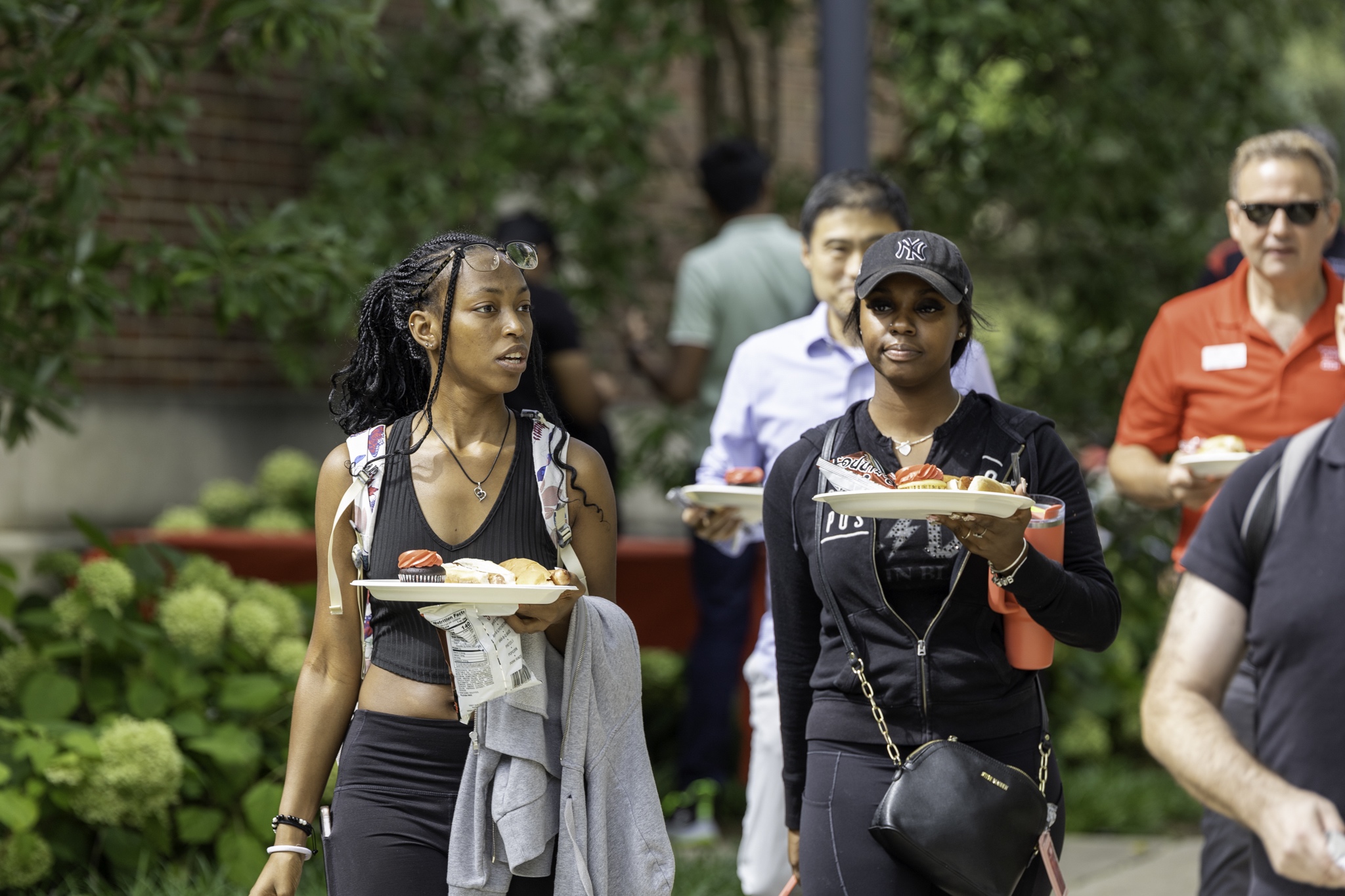 Attendees enjoy the 24th CECH Welcome Back BBQ in the Teacher's-Dyer Complex Courtyard.