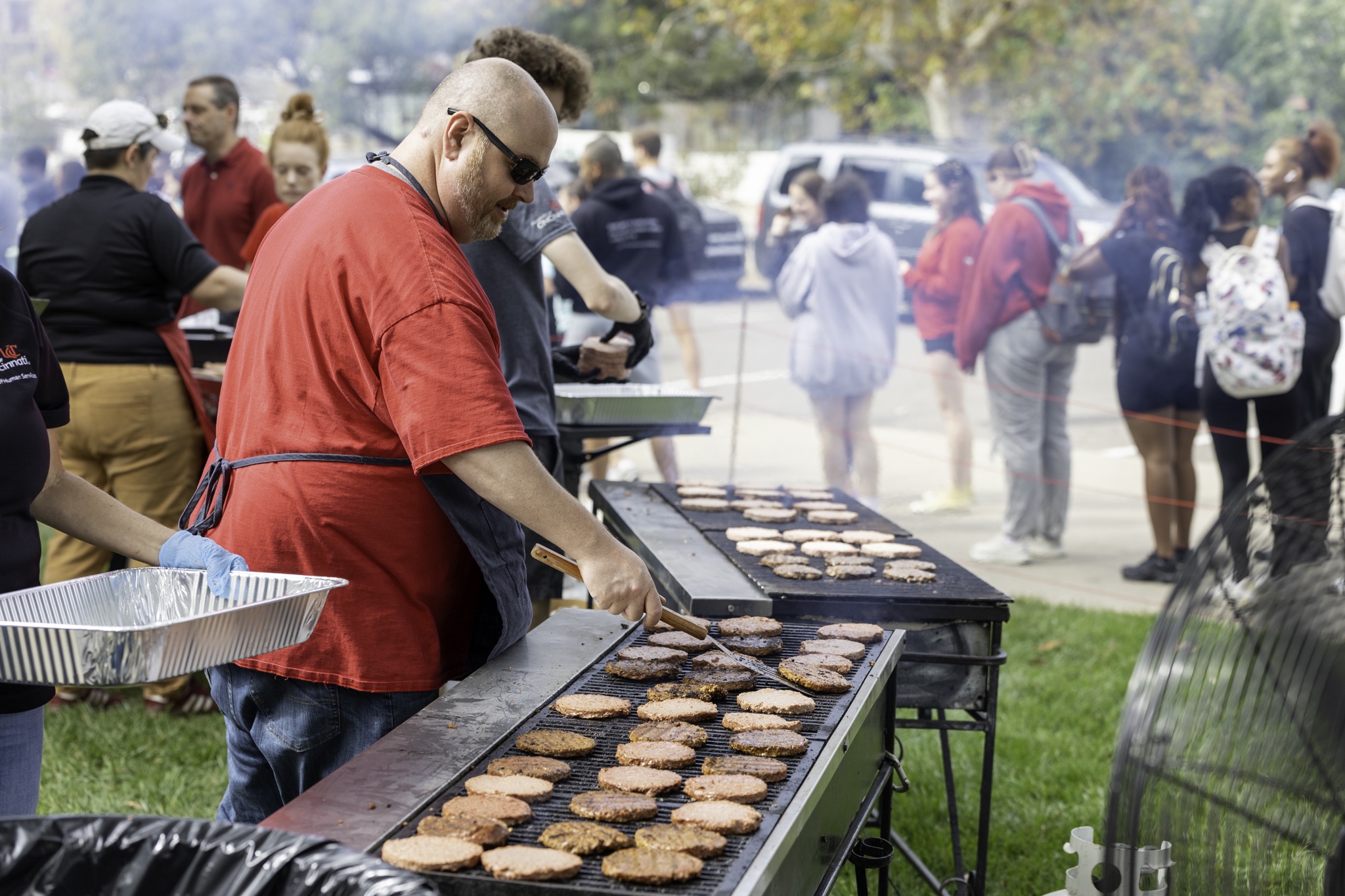 Attendees enjoy the 24th CECH Welcome Back BBQ in the Teacher's-Dyer Complex Courtyard.