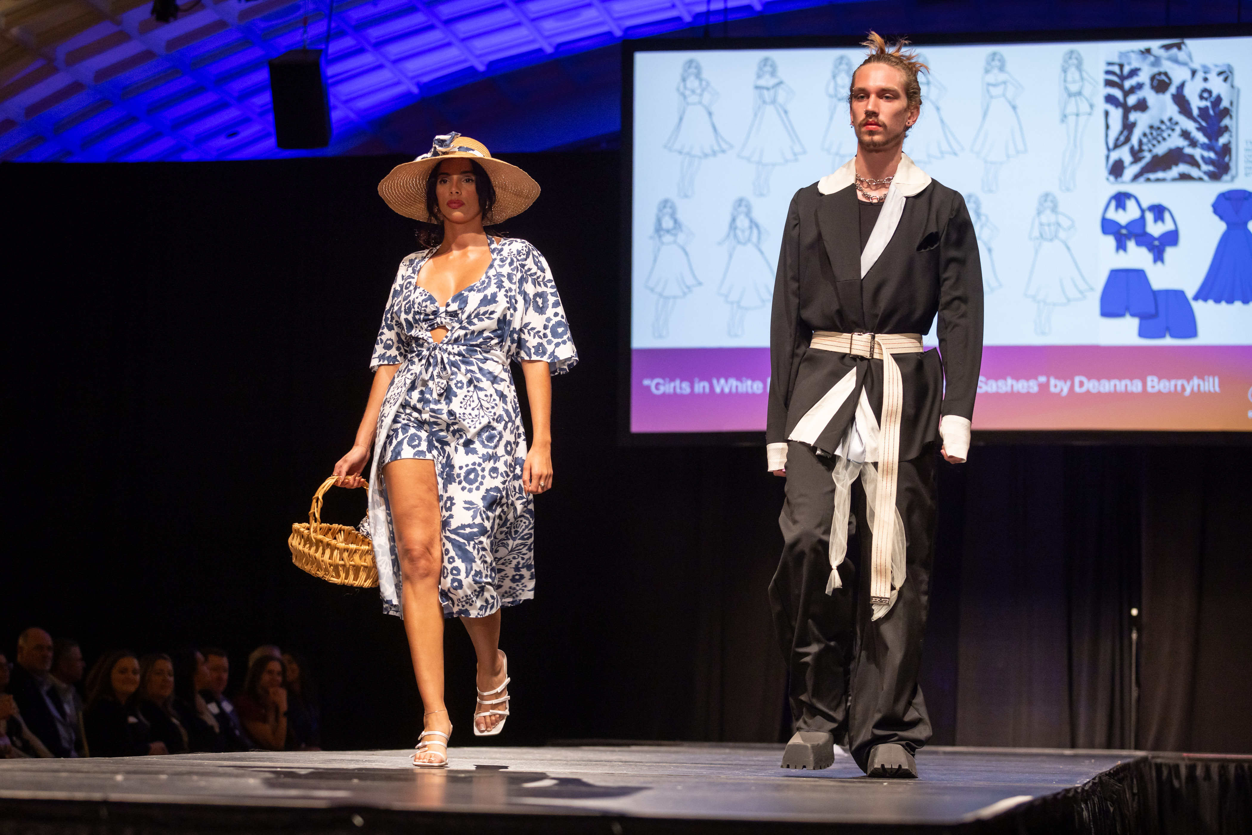 Two models on the runway wearing ensembles created from thrifted items