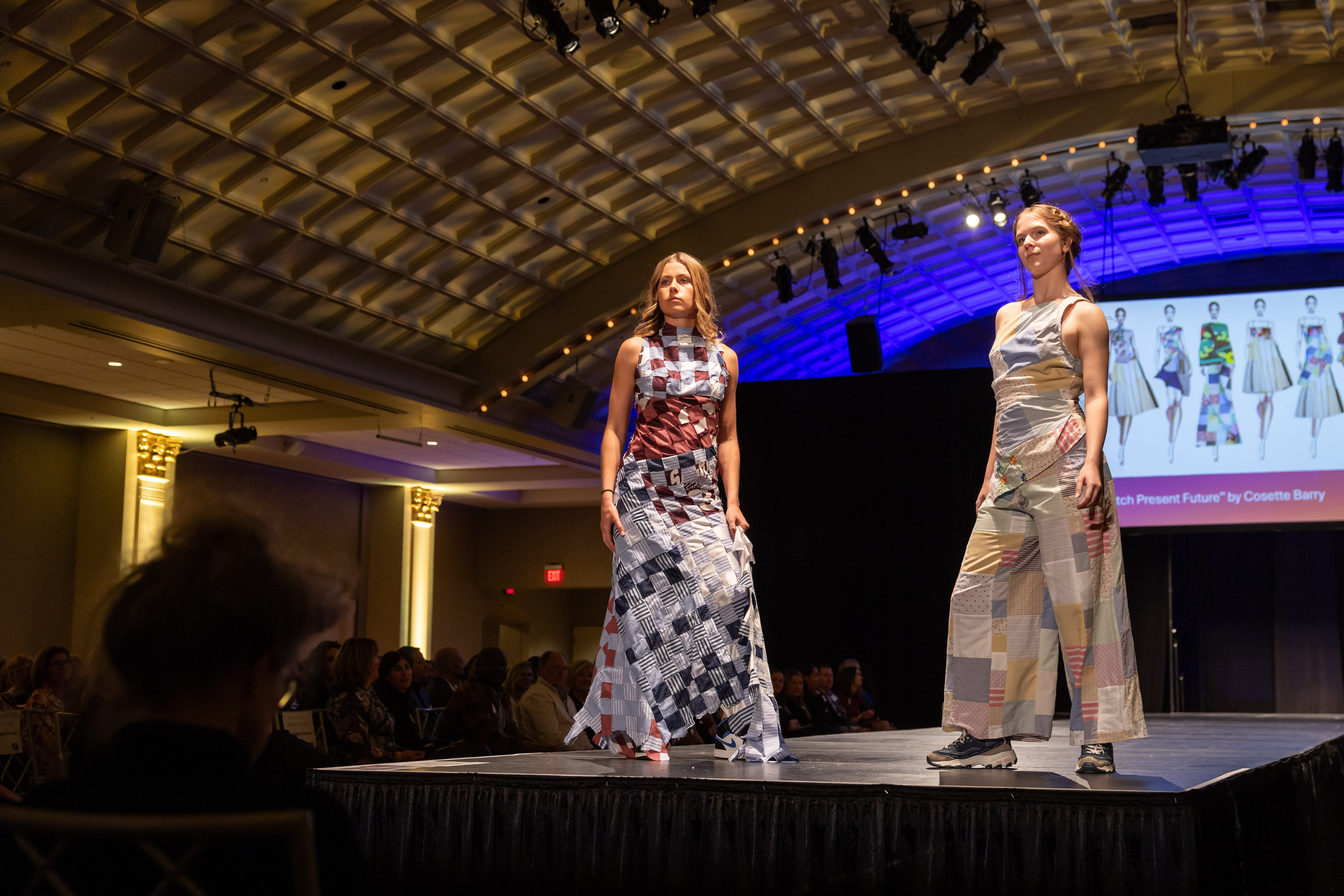 two models on the runway wearing ensembles made from thrifted items 