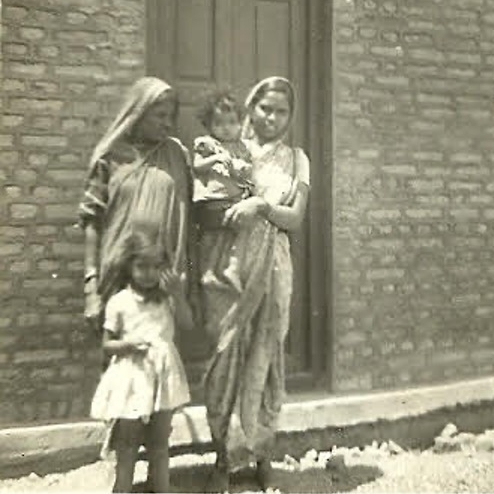 Shailaja Paik’s mother holding her in her arms. Courtesy of Shailaja Paik.