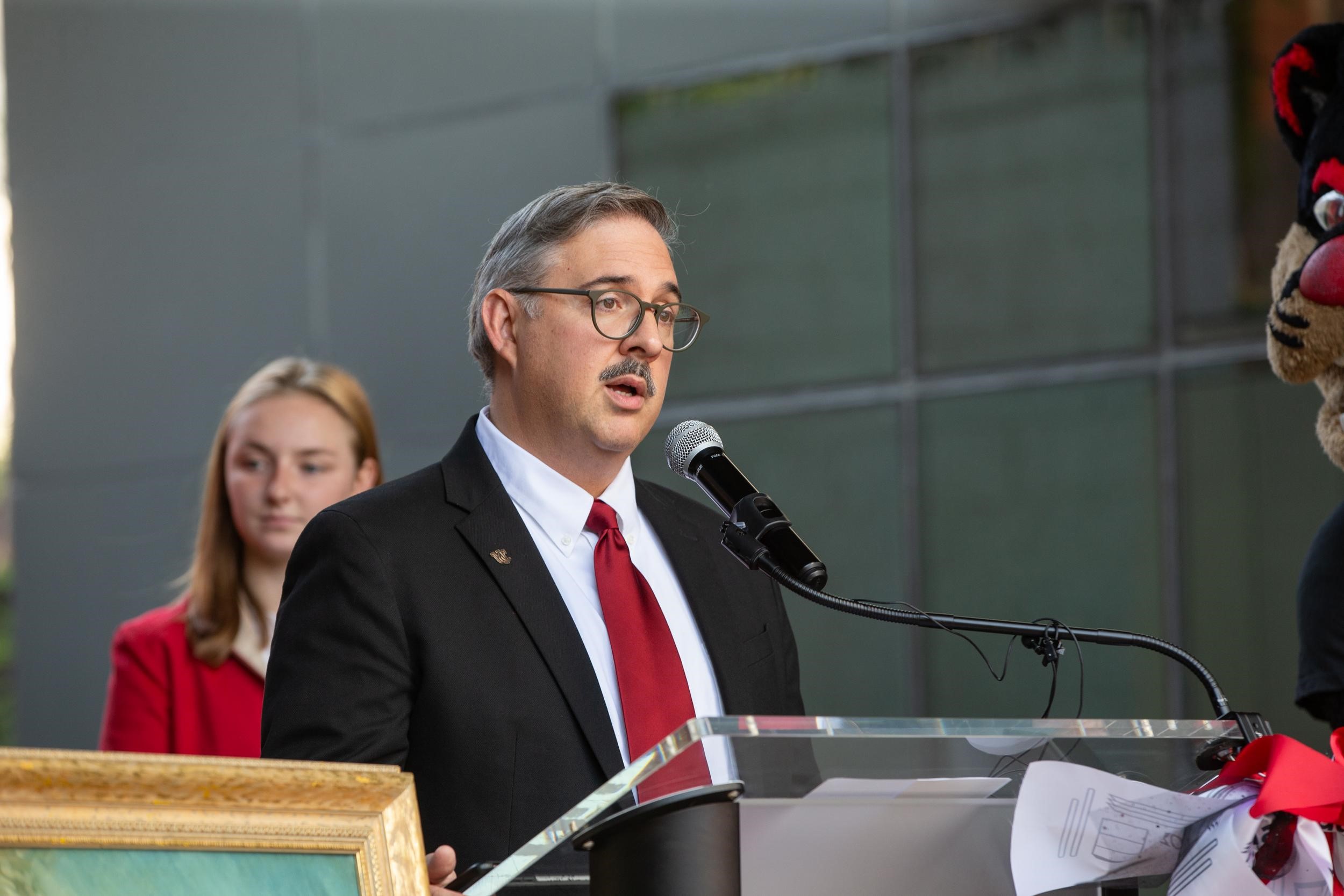 UC vice president of housing Carl Dieso at the podium