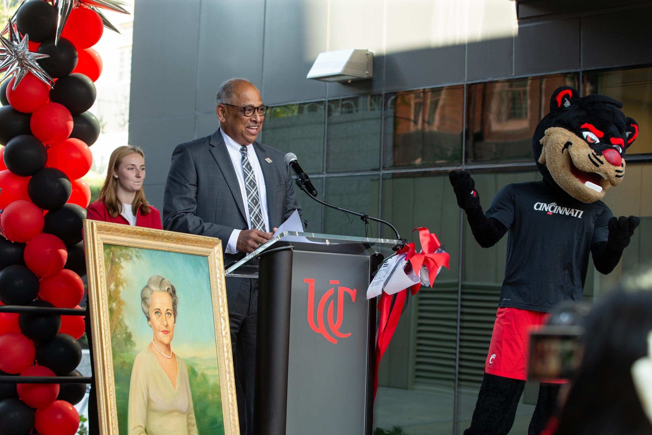 UC President stands at podium and addresses crowd.