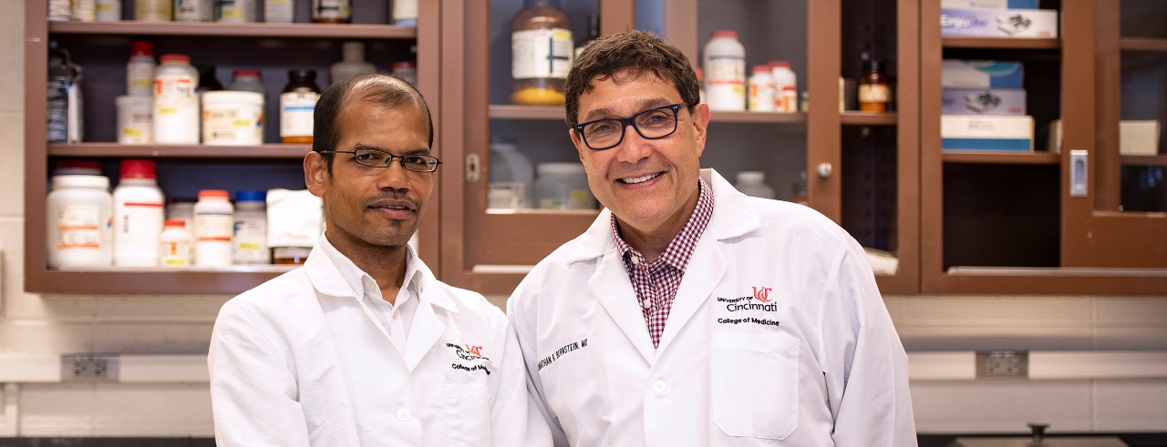 Umesh Singh, PhD, and Jonathan Bernstein, MD, are shown in a laboratory in the UC College of Medicine.