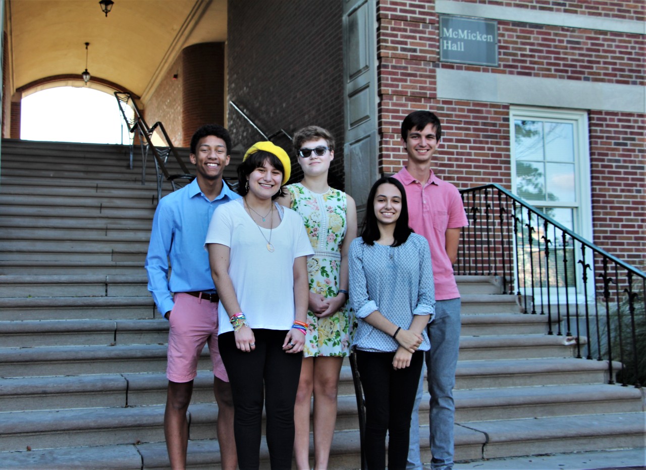 UC College of Arts and Sciences 2018-19 Honors Scholars stand on the steps of McMicken Hall.