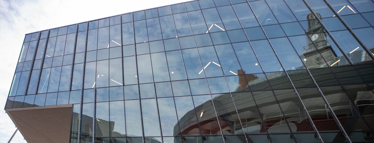 Reflections of TUC in the glass of Nippert West Pavilion
