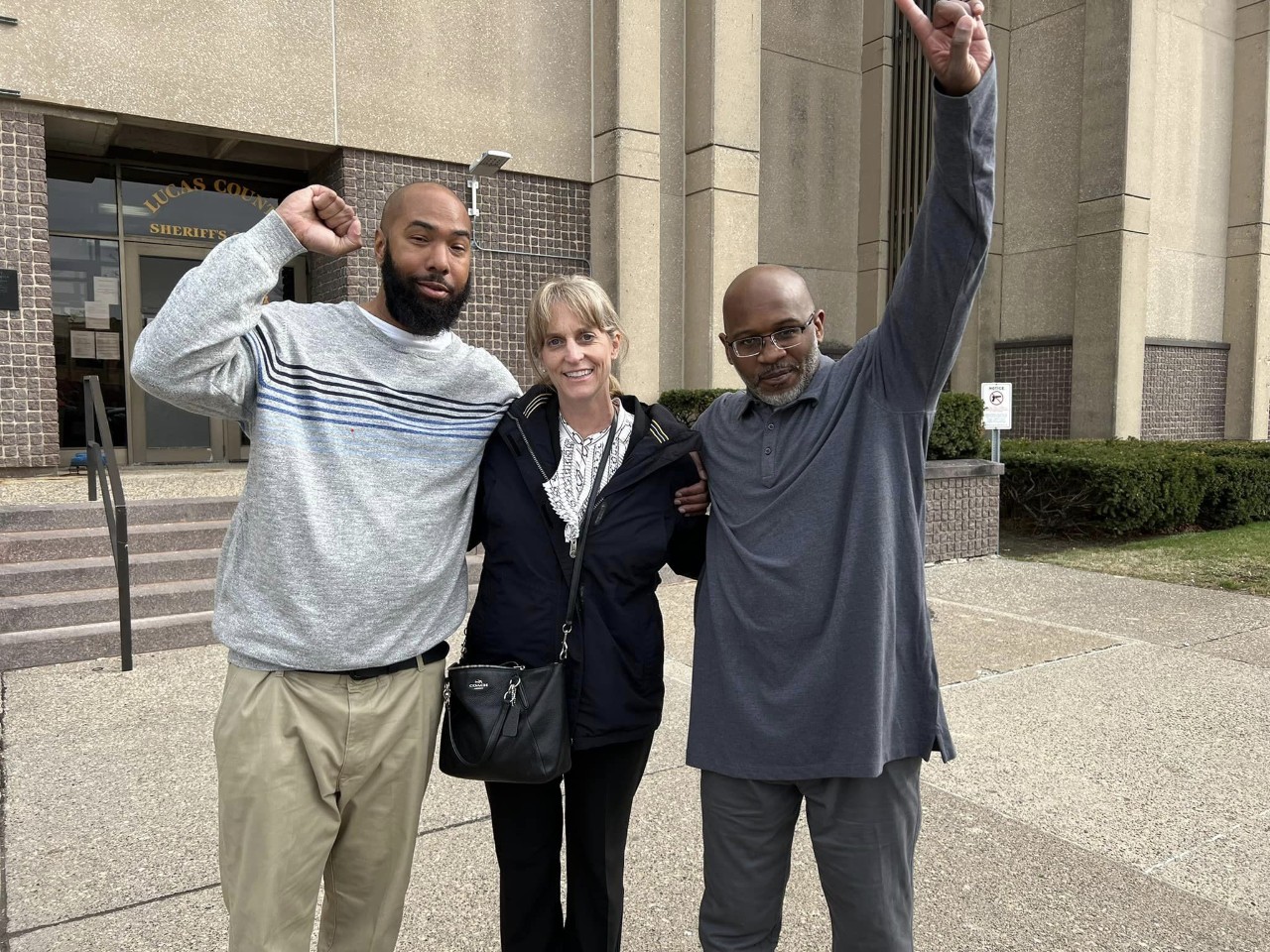 Wayne Braddy Jr. and Karl Willis are shown with OIP attorney Jennifer Bergeron.
