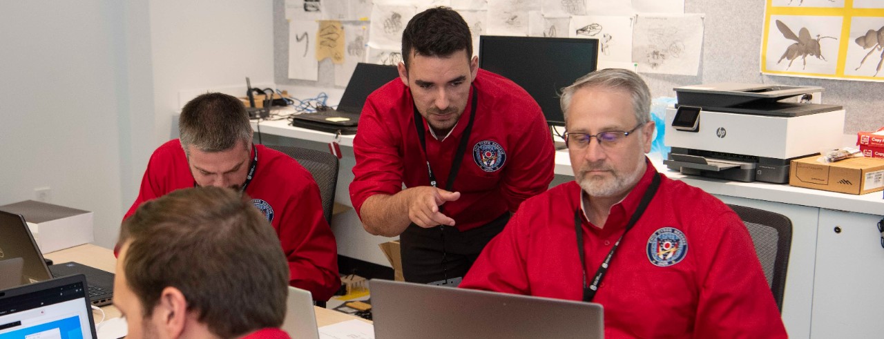 Members of the Ohio Cyber Reserve respond to a simulated attack during a validation exercise at UC Digital Futures. 