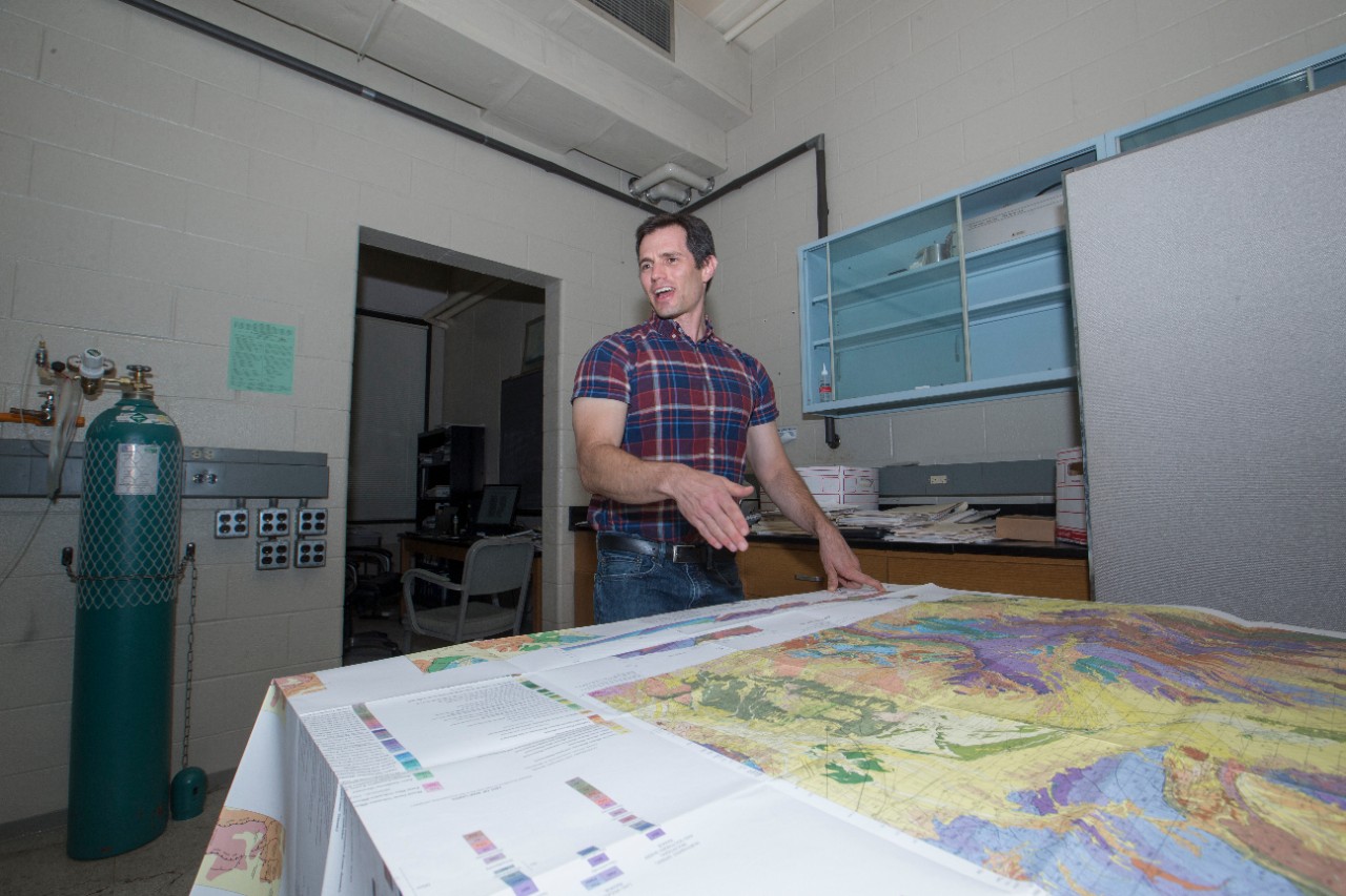 Daniel Sturmer studies a geology map.
