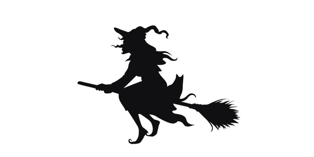 black shadow print of witch on broom