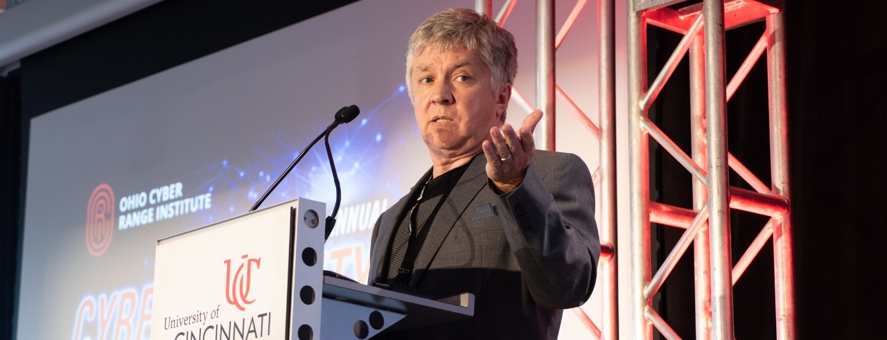 A man gives a speech at a podium.