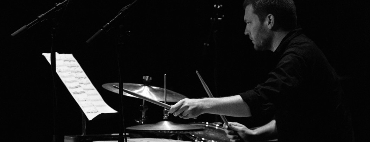 A photograph of new CCM faculty member Adam Groh playing the drums. Photo/Ivan Singer