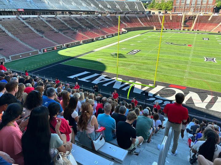 viewing the backs of hundreds of parents and students at Nippert Stadium during orientation at UC