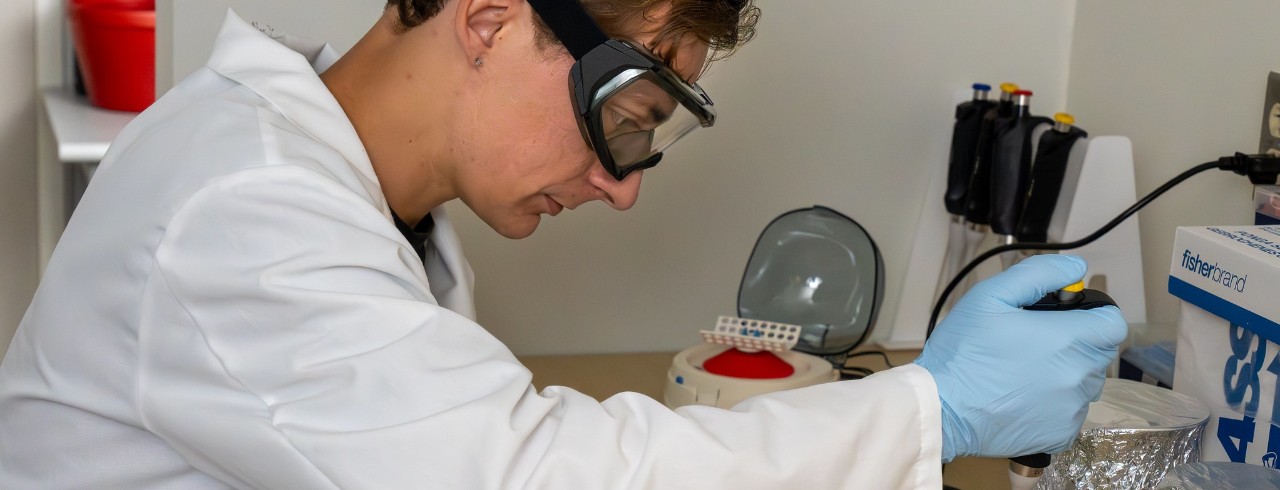 UC Clermont Cronin Scholar and pre-medicine graduate Luke Ustick conducts research in the college's cancer lab