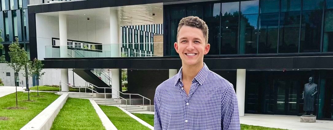 UC law student Nick Anderson stands in front of the newly constructed College of Law building.