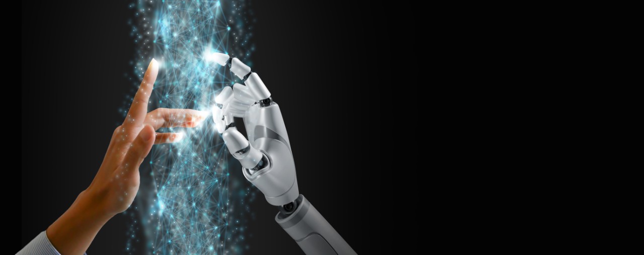 A human hand touches a robot hand in a computer generated image.