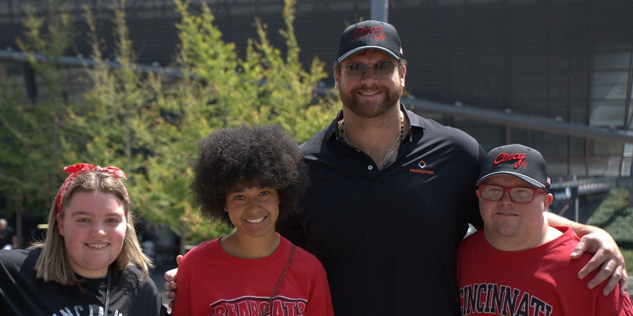 Bengal Ted Karras and TAP students wearing Cincy Hats 