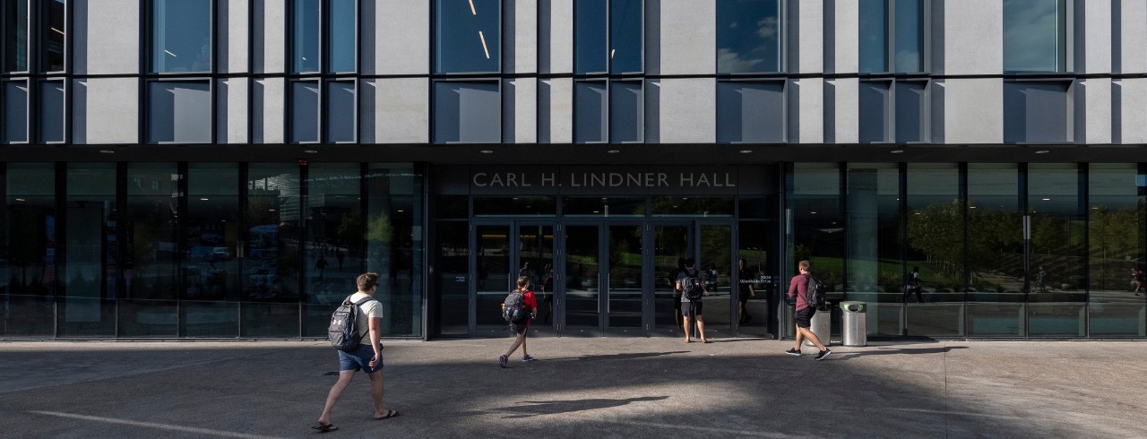 Exterior image of main entrance of Lindner Hall with students walking to enter