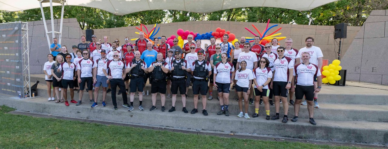 Members of the University of Cincinnati Ride Cincinnati effort gather on stage during the event on September 14.