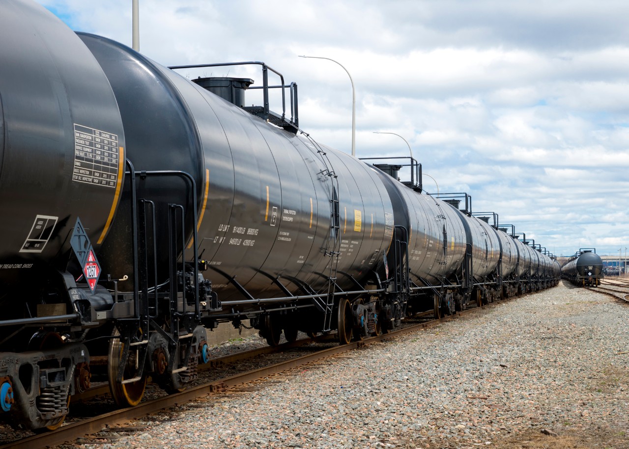 Stock image of line of train cars in rail yard