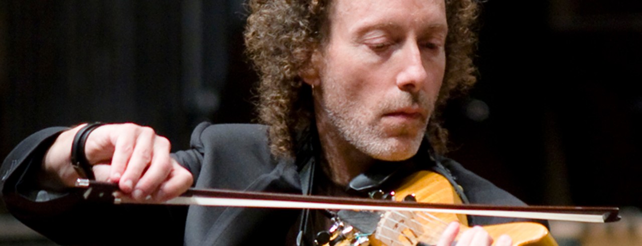 A photograph of Tracy Silverman performing on the violin. Photo/Martin Cherry