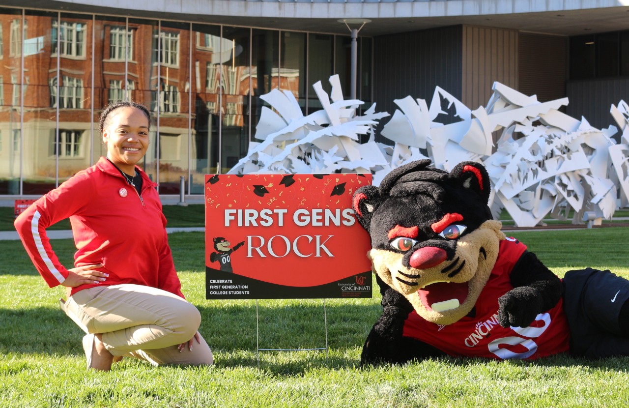 CAHS success coach poses on the lawn with the Bearcat