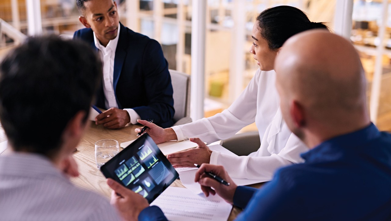 Discussion during a business meeting. Photo/Adobe Stock