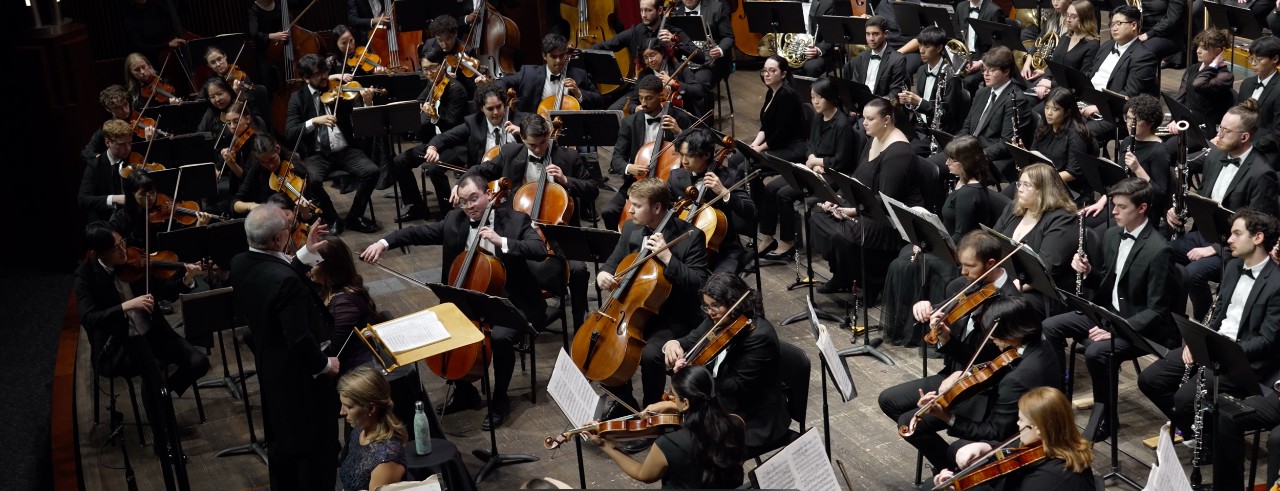 CCM's combined orchestra, choirs and guest artists on stage in Corbett Auditorium. Photo taken from the video recording of CCM's performance on Sept. 21, 2024.