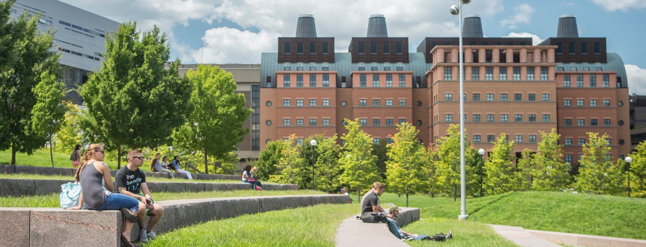 Students study in front of UC's Mantei Center. 