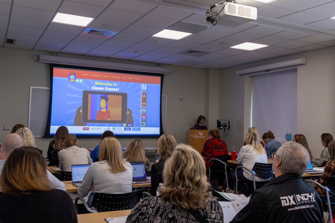 Attendees watch a presentation at the STEM+ Conference at University of Cincinnati