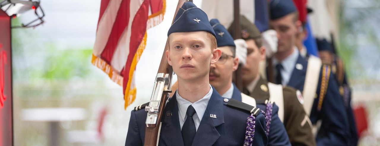 UC cadet carrying a flag in the 2023 Veterans Day opening ceremonies