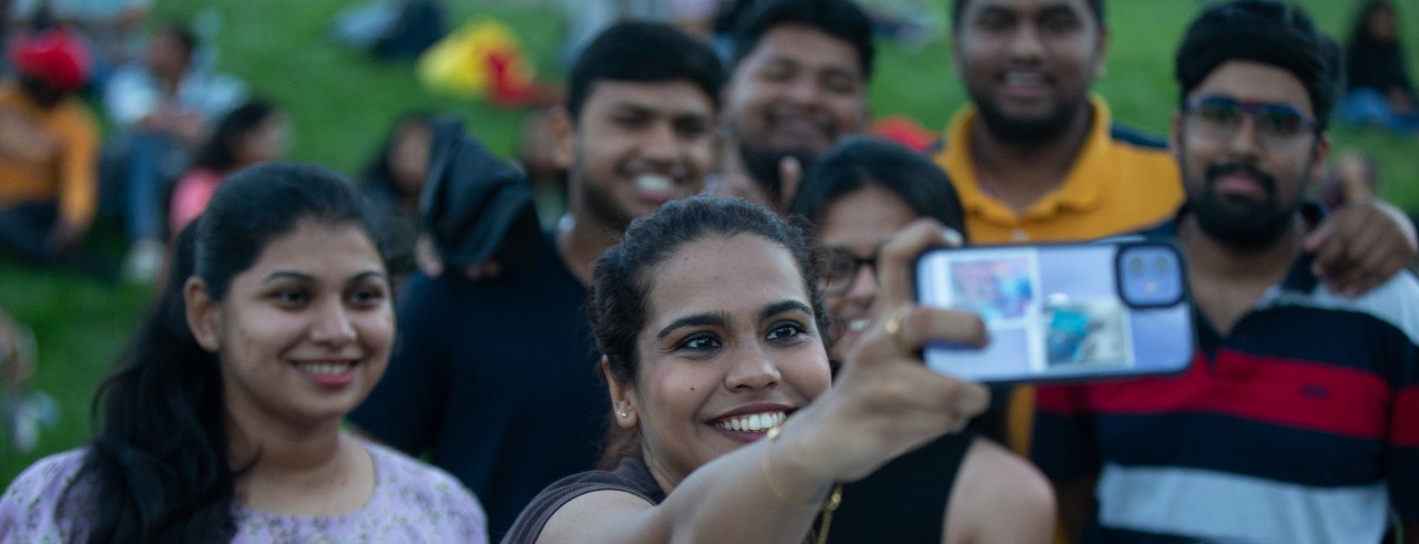 image of seven international students smiling for a selfie