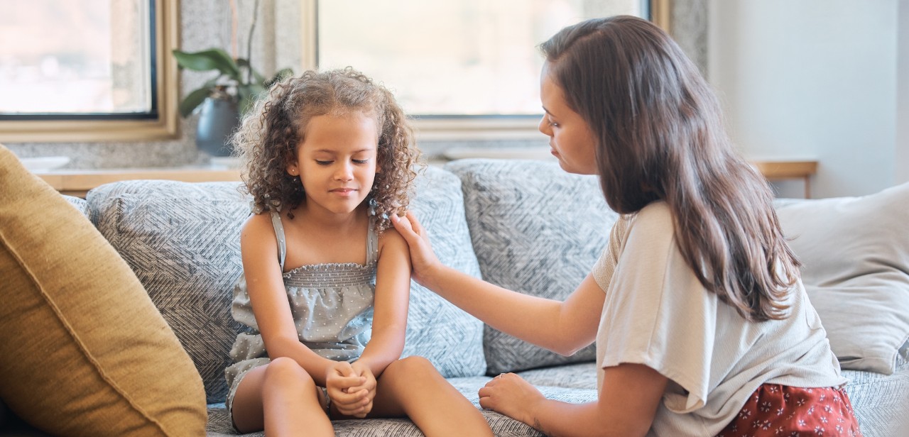 woman showing a child empathy