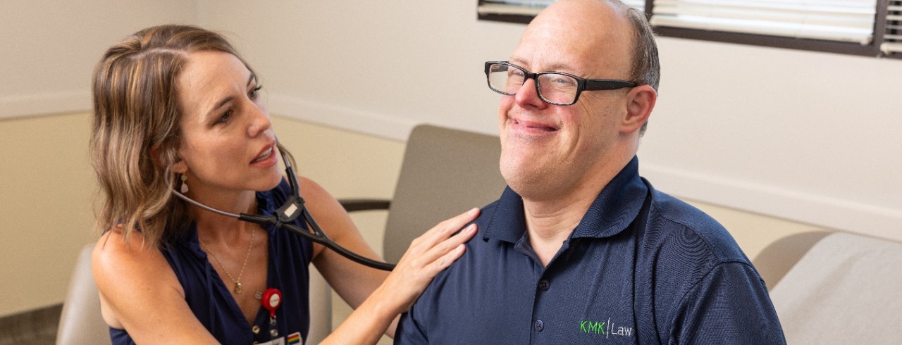 Lauren Wang, MD, director of the Freeman Center, examines a patient. 