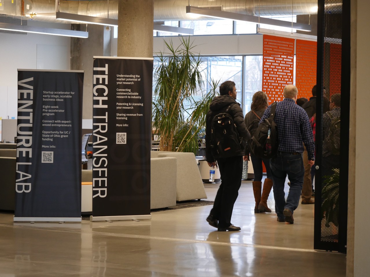 People walk into the Venture Lab space in UC's 1819 Innovation Hub.