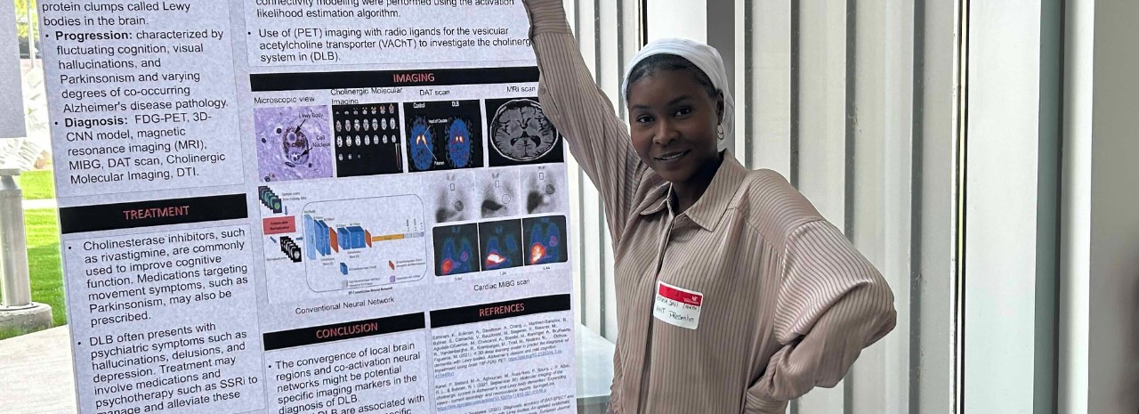 Aisseta Sall in front of her poster presentation