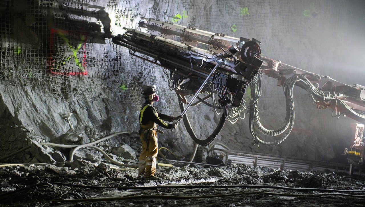 A worker excavates a cavern for the Deep Underground Neutrino Experiment.