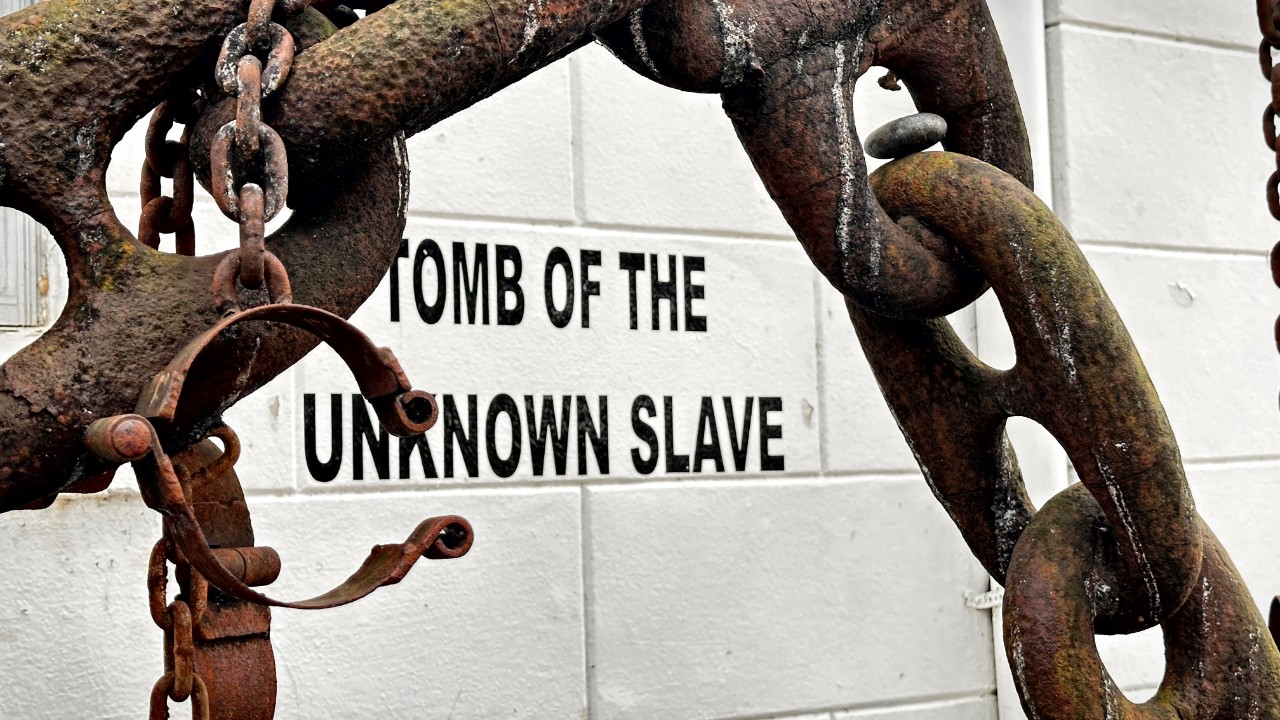 Tomb of Unknown Slave remembrance historical marker. Metal and rust on chains and shackles. St Augustine Catholic Church, New Orleans, Louisiana, USA.