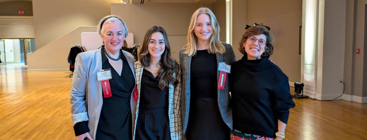 four women in business attire at the 2024 Women Who Mean Business event