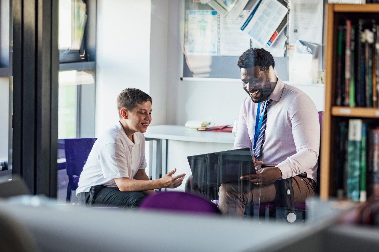 school age child in an office talking to the counselor